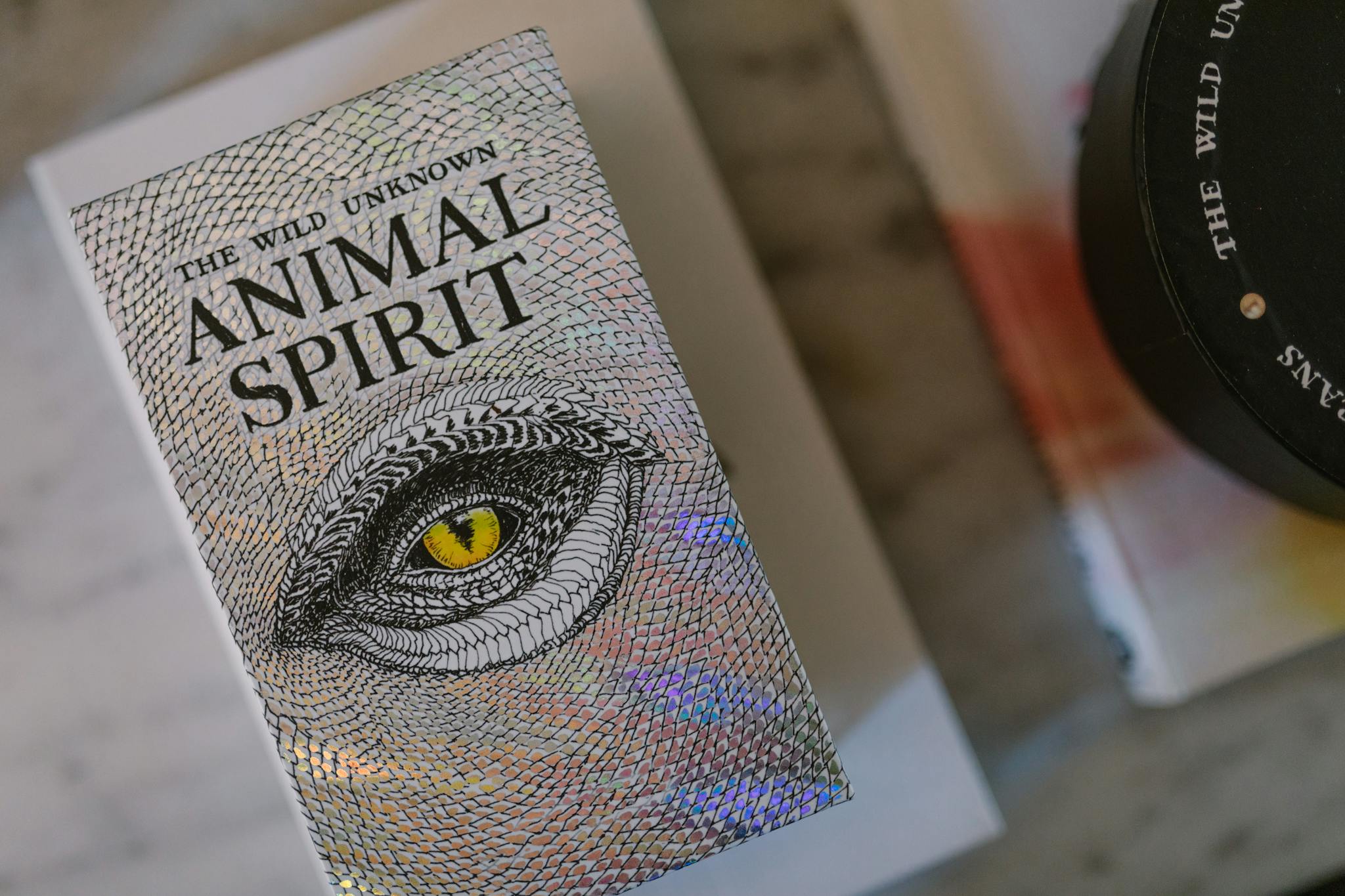 A close-up shot of The Wild Unknown Animal Spirit Deck showcasing its mystical cover.